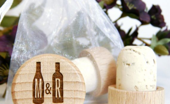 Personalized wine cork with two wine bottles, monogram, and wedding date.